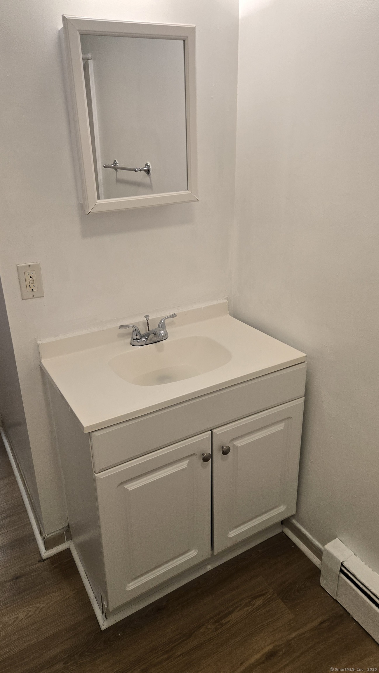 117 Dikeman Street Waterbury, CT 06704 - Photo 14 of 17 a bathroom with a sink and a mirror