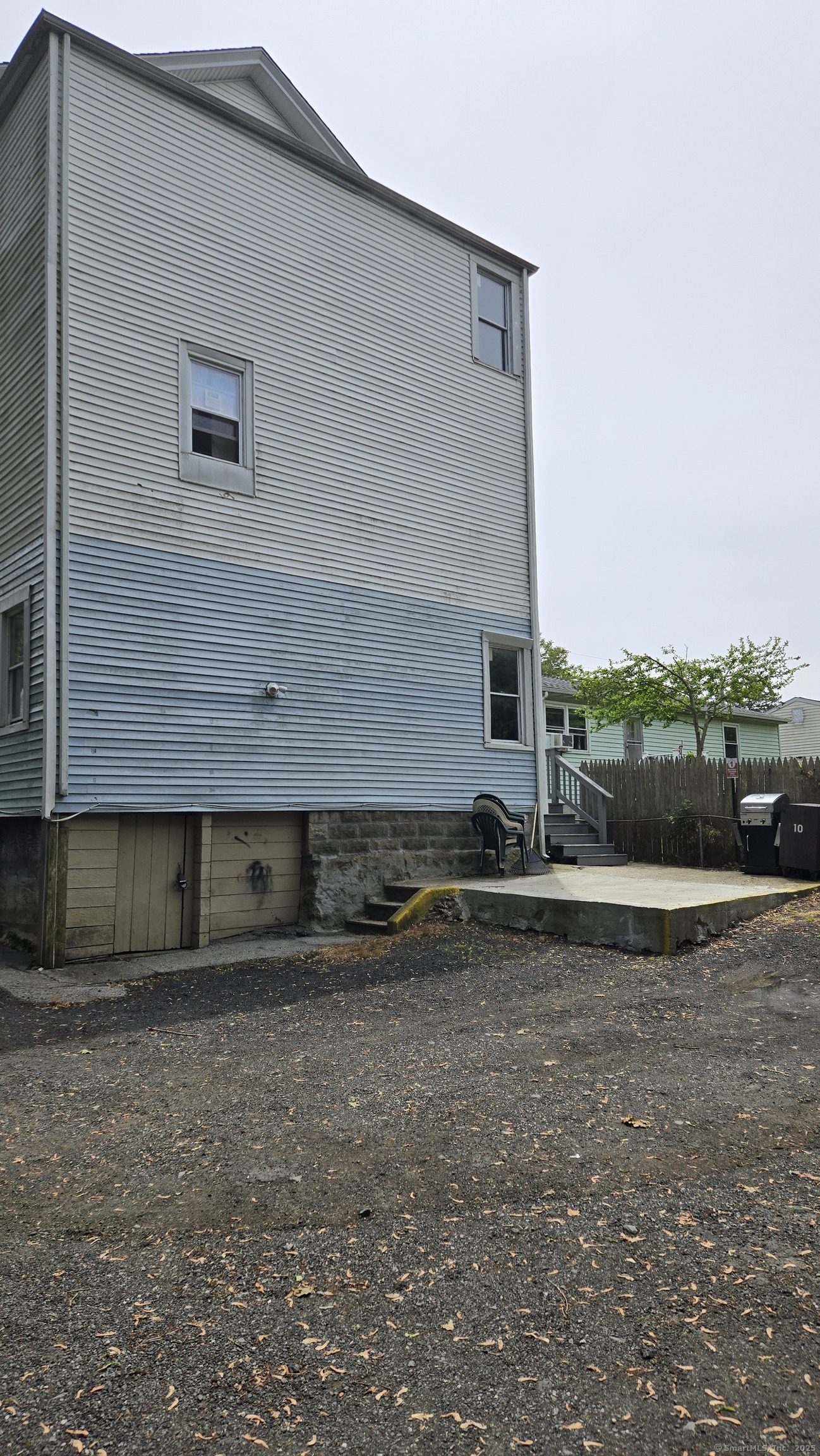 117 Dikeman Street Waterbury, CT 06704 - Photo 16 of 17 a front view of a house with a yard