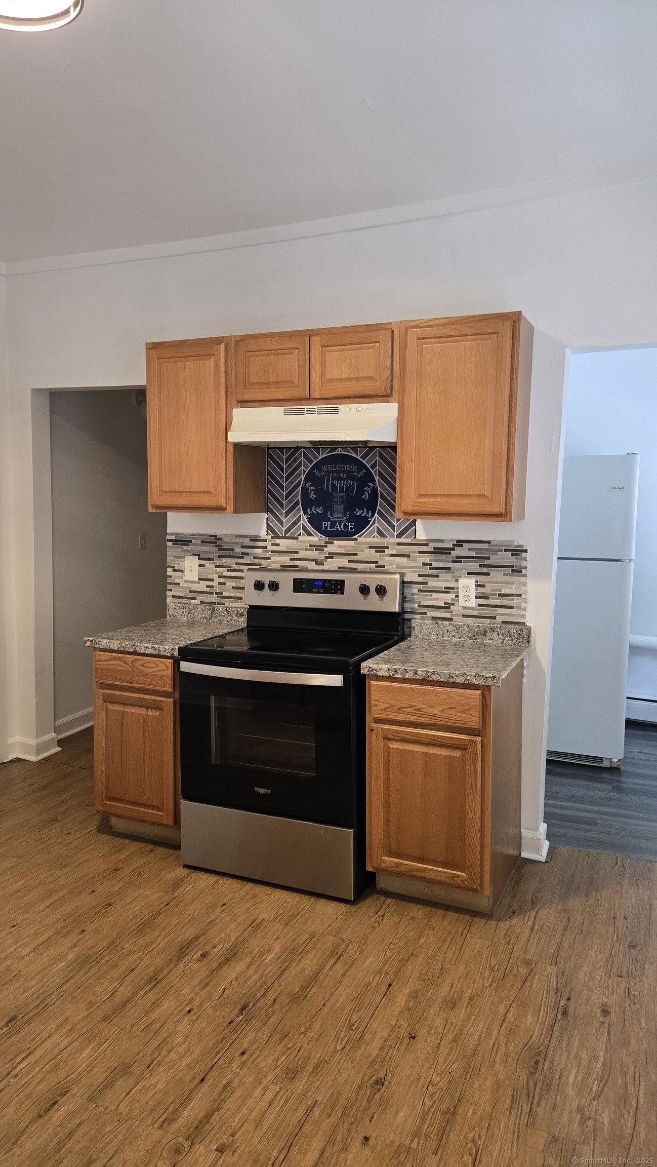 117 Dikeman Street Waterbury, CT 06704 - Photo 2 of 17 a kitchen with a stove and a sink
