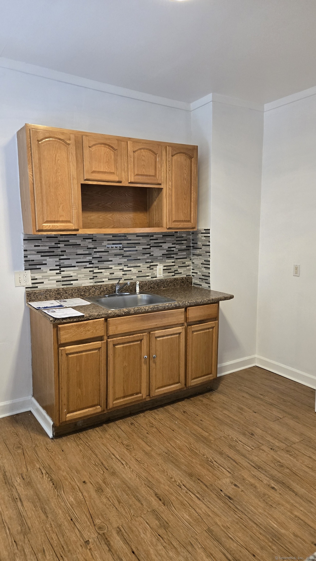 117 Dikeman Street Waterbury, CT 06704 - Photo 4 of 17 a kitchen with stainless steel appliances granite countertop a stove a sink and a microwave