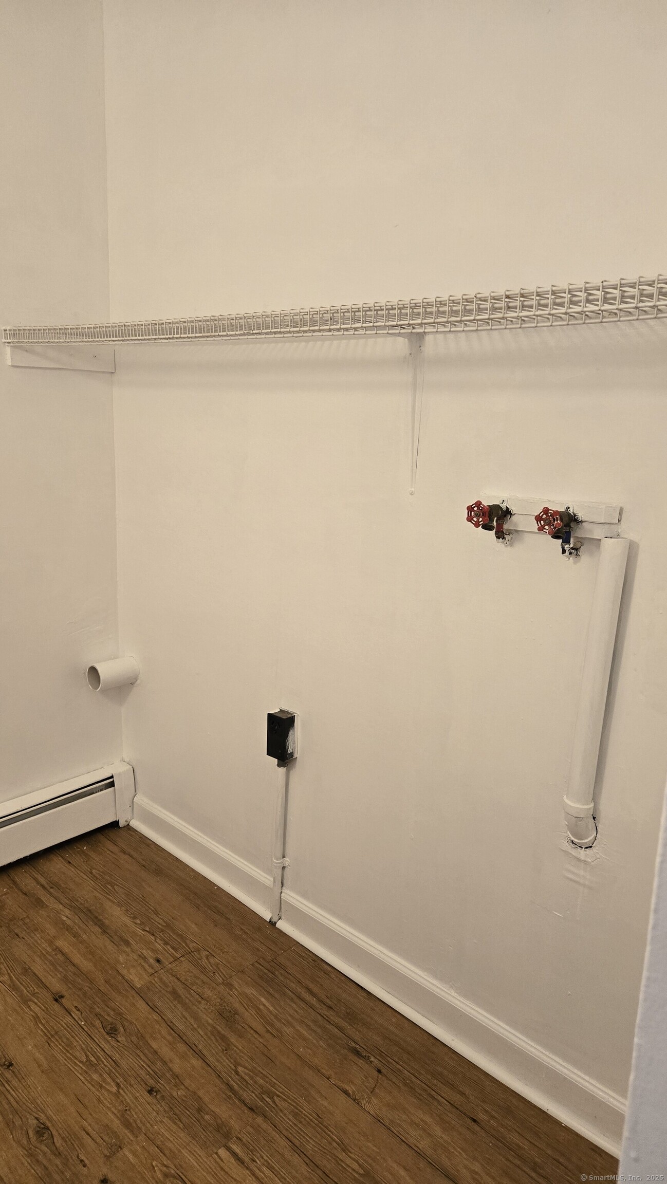 117 Dikeman Street Waterbury, CT 06704 - Photo 10 of 17 a view of a room with wooden floor