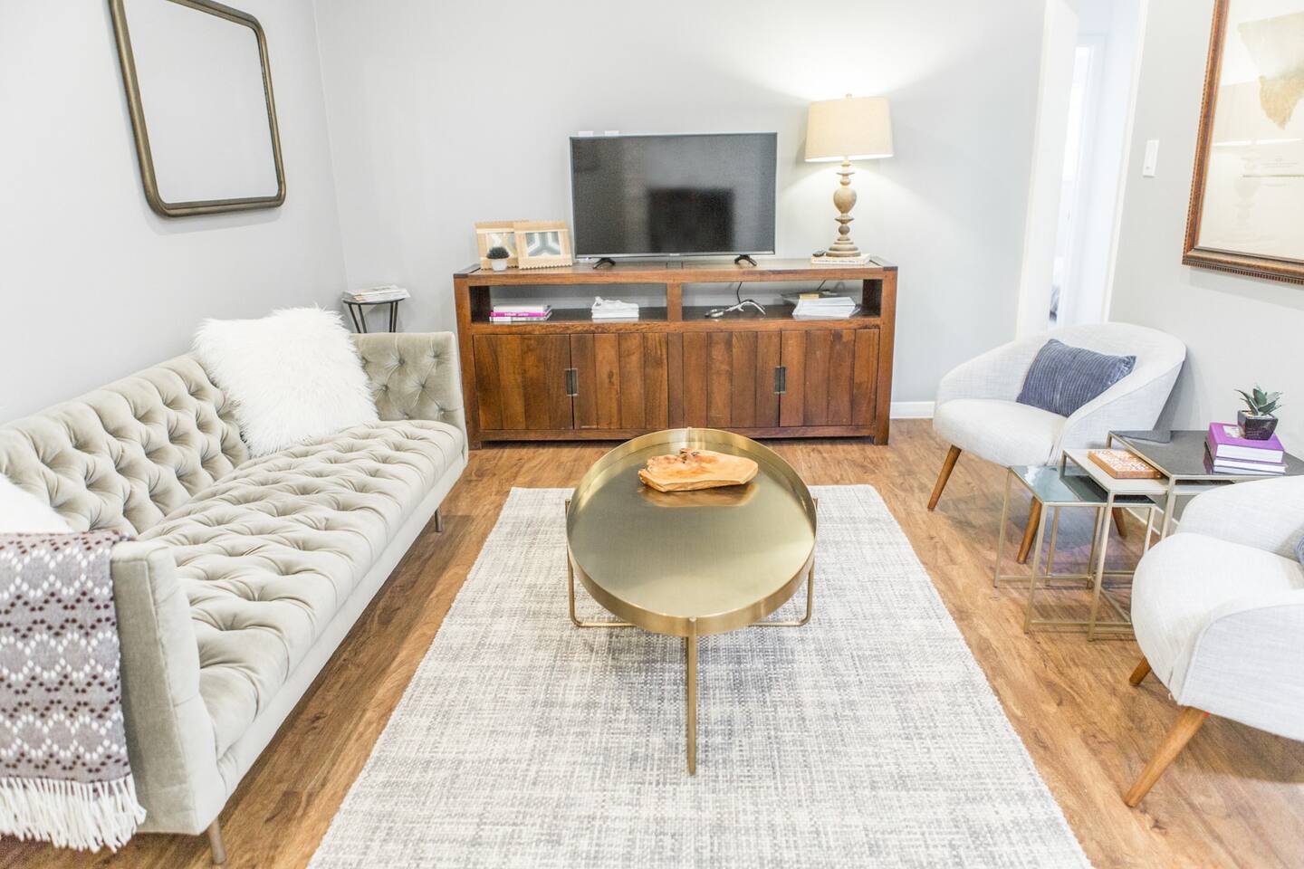 1913 Rabb Road, Unit B Austin, TX 78704 - Photo 4 of 10 A well-lit living area offers abundant comfort and natural wood flooring.