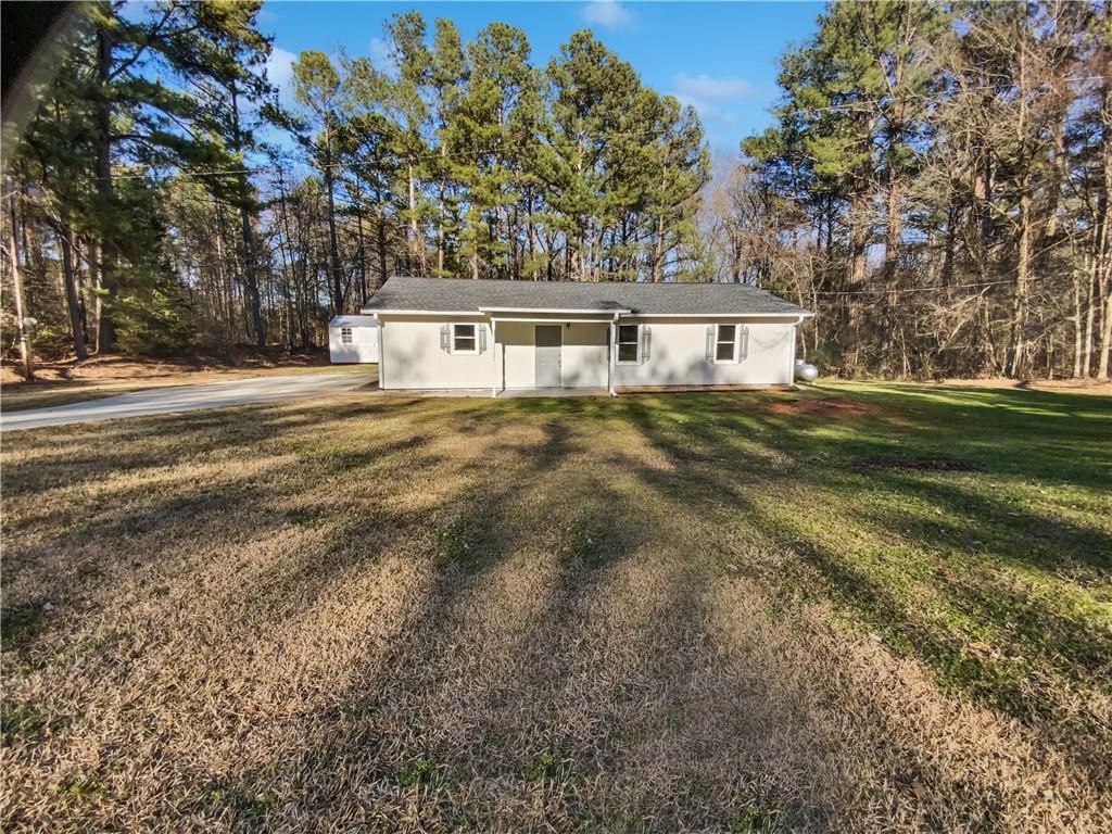 3103 Mote Road Covington, GA 30016 - Photo 1 of 1 a front view of a house with a yard