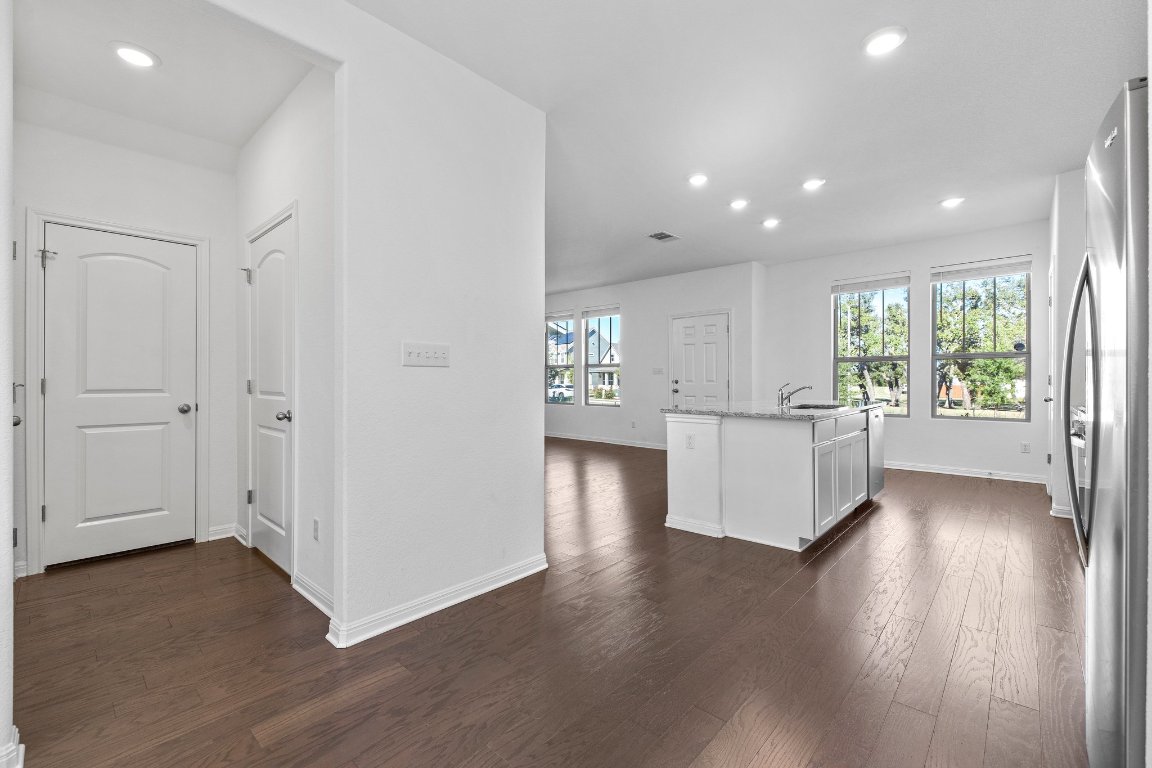 2429 Acoma Lane Leander, TX 78641 - Photo 22 of 39 a view of an empty room with wooden floor and a window