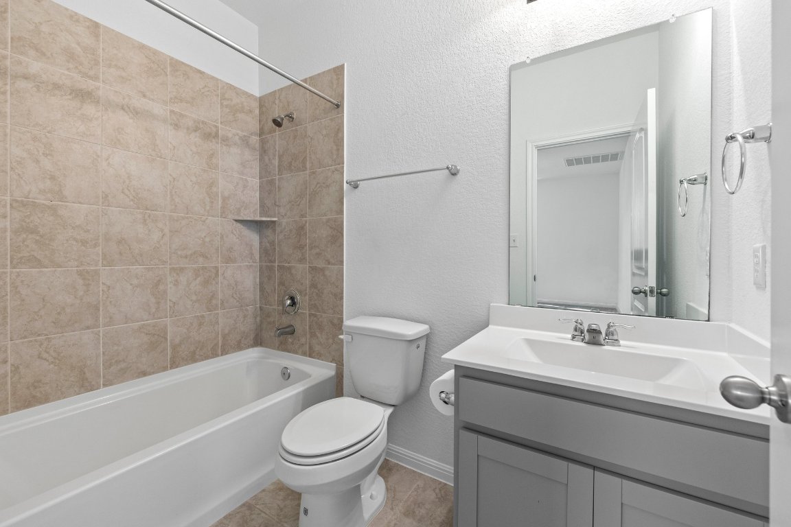 2429 Acoma Lane Leander, TX 78641 - Photo 28 of 39 a bathroom with a sink toilet and shower
