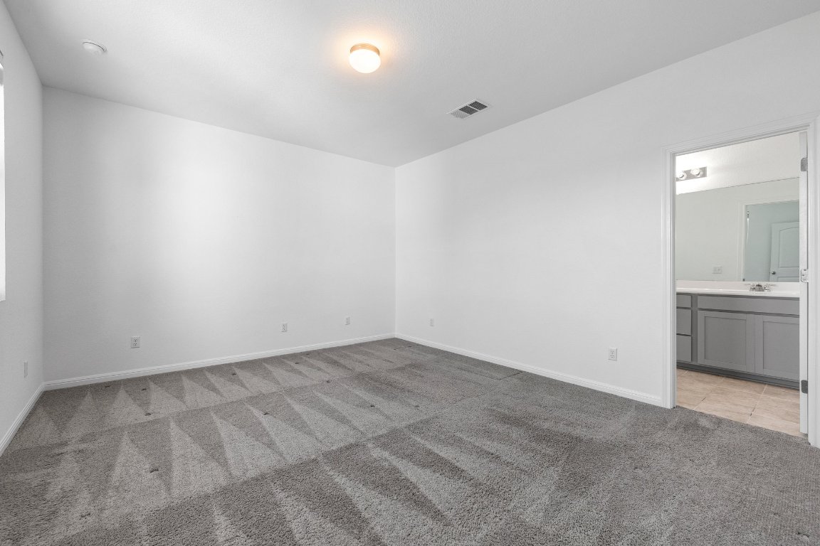 2429 Acoma Lane Leander, TX 78641 - Photo 29 of 39 an empty room with a kitchen