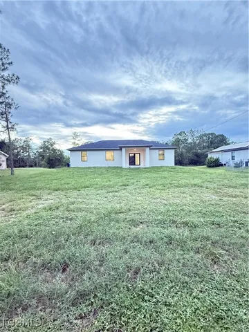 an aerial view of residential house with an outdoor space
