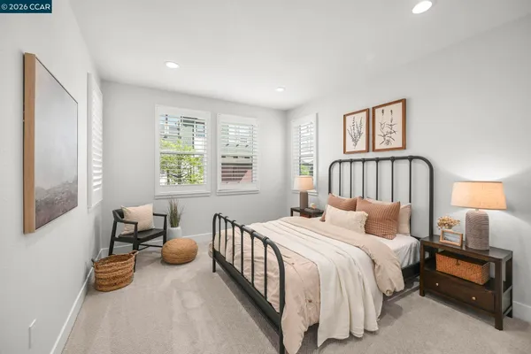 a bedroom with bed and a window