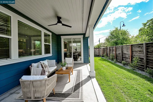 a view of a house with backyard and porch