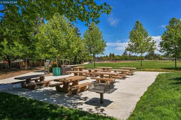 a view of a park with swings and slides