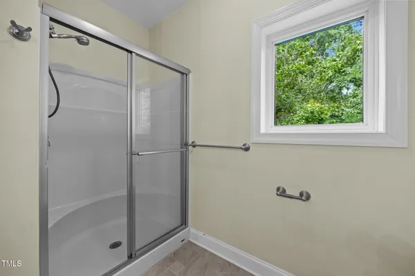 a view of an empty room with glass door
