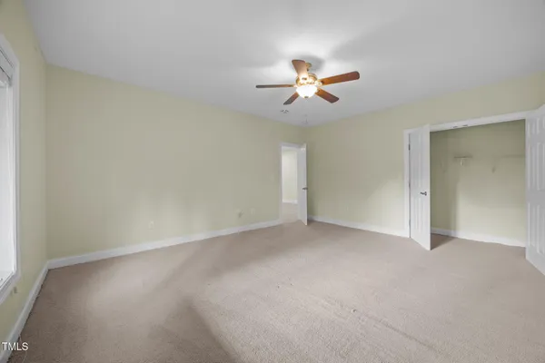 a view of a house with a yard and plants