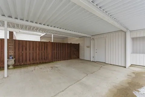 a view of a car park in front of house