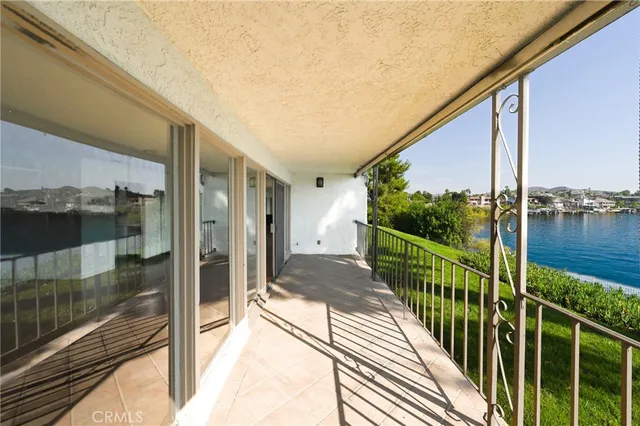 a view of a house with swimming pool and sitting area