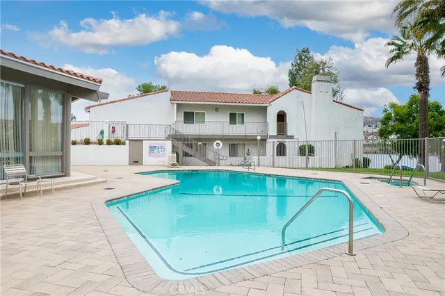 a view of a swimming pool with a garden