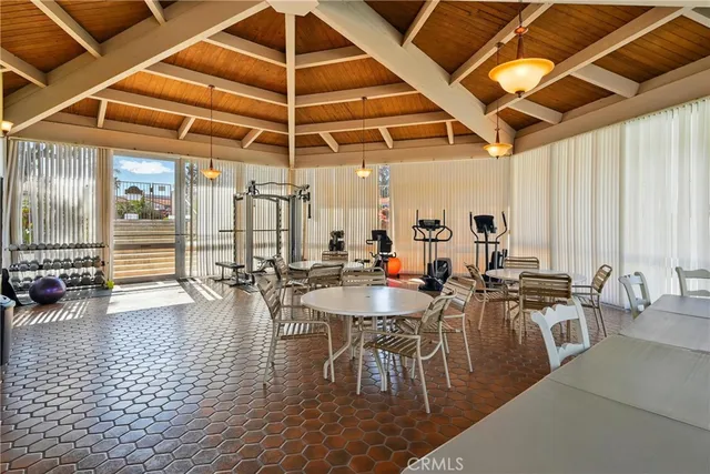 an aerial view of a house with garden space and lake view