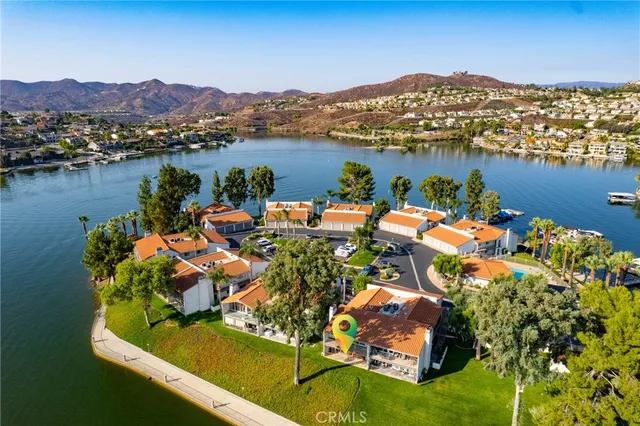 an aerial view of a house with a lake view