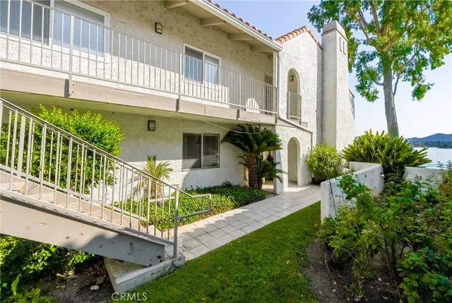 a white toilet sitting next to a shower curtain