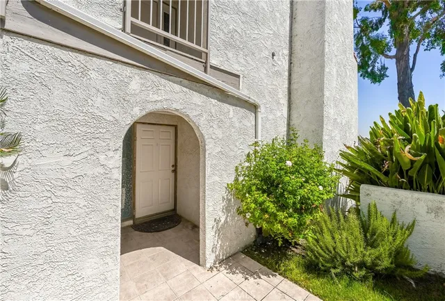 a view of a swimming pool with a patio and a yard