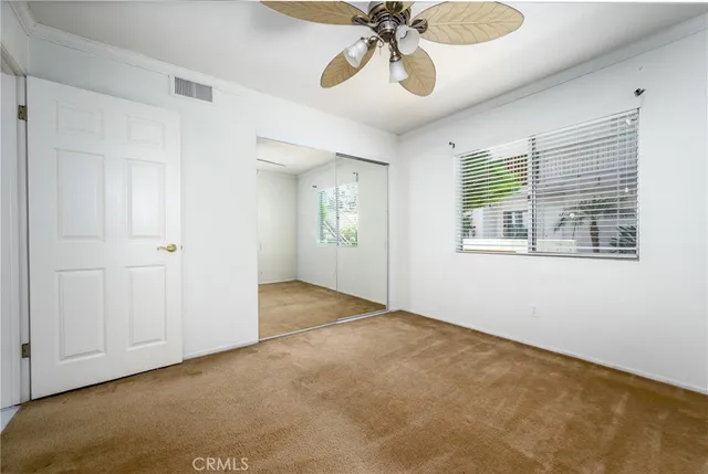 a view of a swimming pool with a patio and a yard