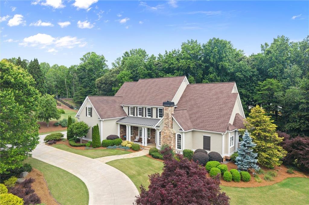 322 Edwards Brook Lane Canton, GA 30115 - Photo 99 of 99 a aerial view of a house with a yard table and chairs
