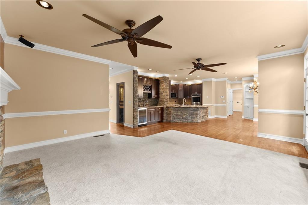 4863 Rosemoore Court Suwanee, GA 30024 - Photo 13 of 74 a view of a livingroom with a ceiling fan