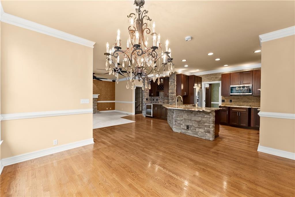 4863 Rosemoore Court Suwanee, GA 30024 - Photo 15 of 74 a view of a living room and kitchen