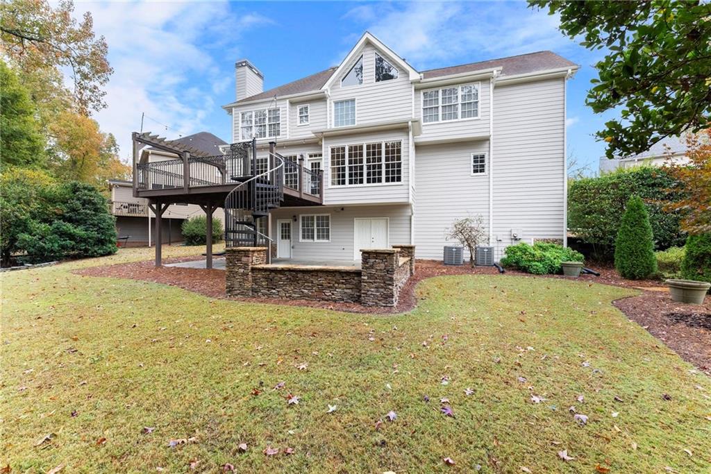 4863 Rosemoore Court Suwanee, GA 30024 - Photo 50 of 74 a view of a house with pool and sitting area