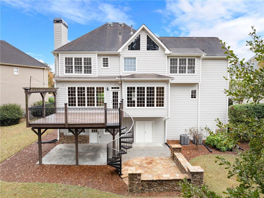 4863 Rosemoore Court Suwanee, GA 30024 - Photo 59 of 74 a front view of a house with garden