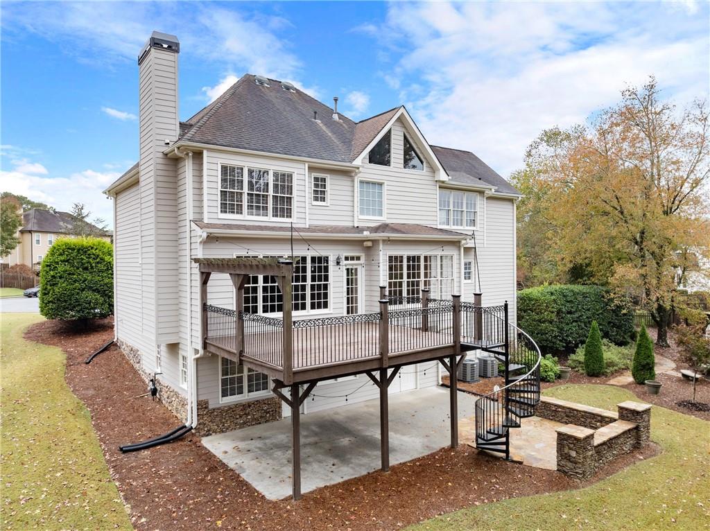 4863 Rosemoore Court Suwanee, GA 30024 - Photo 60 of 74 a front view of a house with a yard