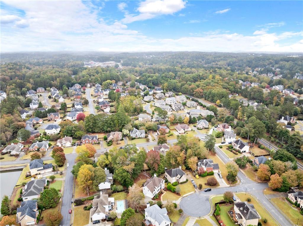4863 Rosemoore Court Suwanee, GA 30024 - Photo 67 of 74 an aerial view of residential houses with outdoor space