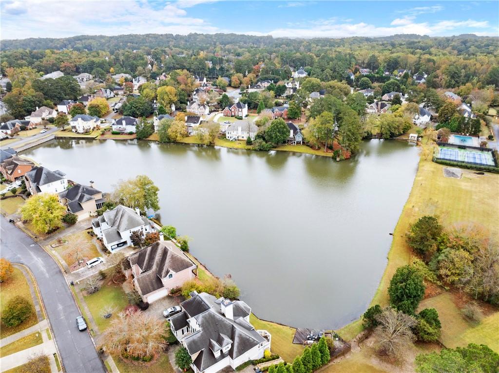 4863 Rosemoore Court Suwanee, GA 30024 - Photo 72 of 74 an aerial view of a house with a lake view