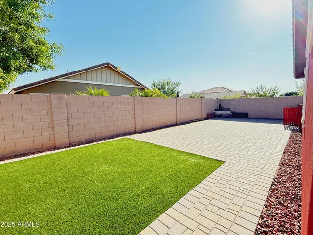 a view of a backyard of the house