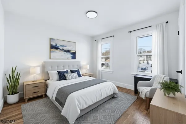 a bedroom with bed furniture and a window