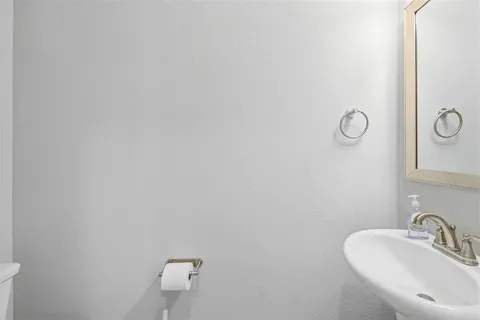 a bathroom with a sink and mirror