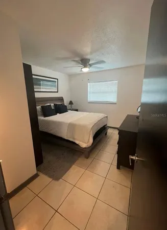 a bedroom with a bed and a walk in closet