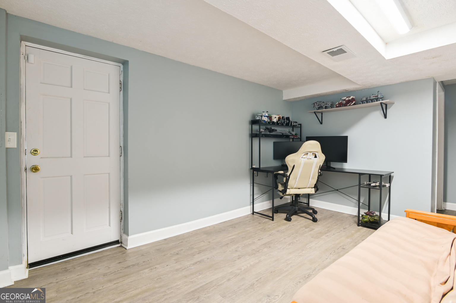 545 Forest Hill Road Macon, GA 31210 - Photo 57 of 63 a view of a workspace with furniture and a gym equipment