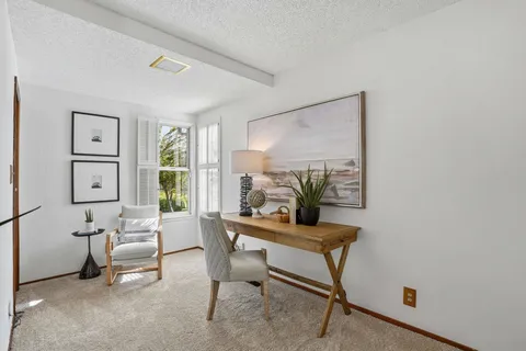 a room with furniture and a window