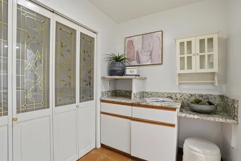 a kitchen with stainless steel appliances granite countertop a sink and cabinets