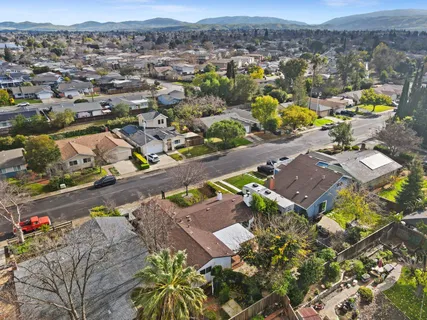 an aerial view of residential houses with outdoor space