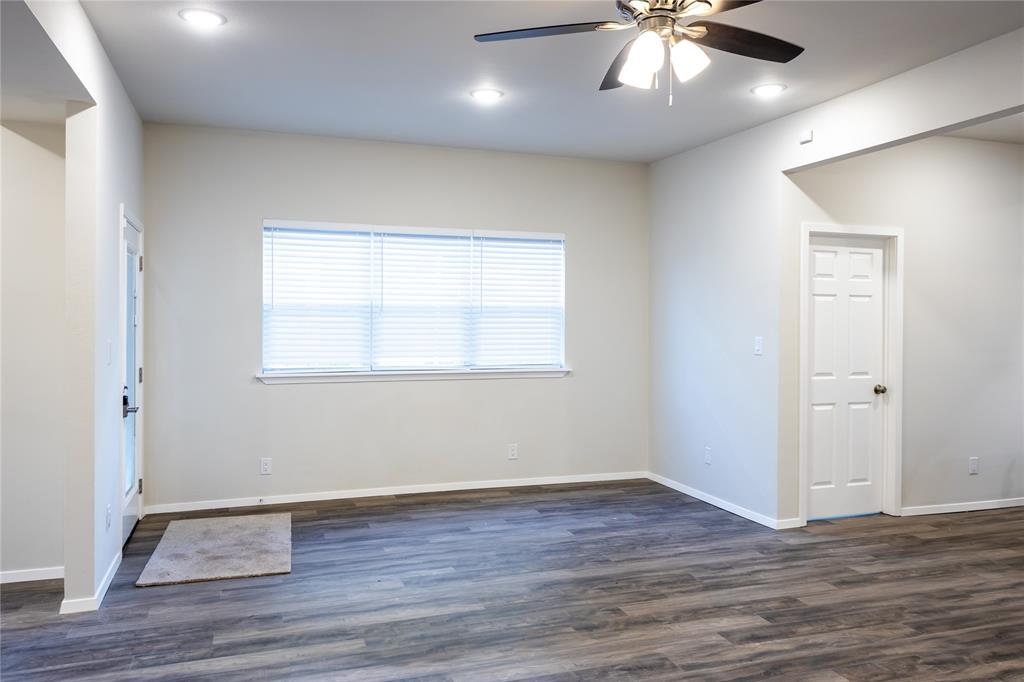 4522 Reiger Avenue Dallas, TX 75246 - Photo 20 of 37 Unfurnished room with dark hardwood / wood-style floors and ceiling fan
