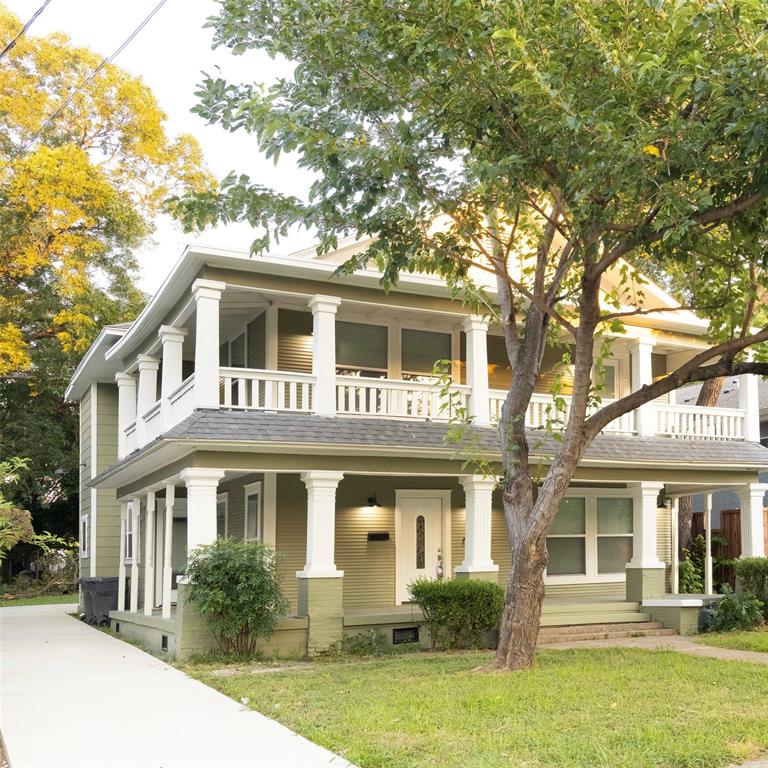 4522 Reiger Avenue Dallas, TX 75246 - Photo 2 of 37 Greek revival inspired property featuring a balcony, a front yard, and a porch