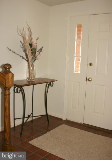 8033 Broken Reed Court Frederick, MD 21701 - Photo 11 of 27 Entry Foyer With Ceramic Floors And Neutral Paint