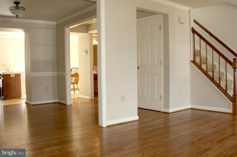 8033 Broken Reed Court Frederick, MD 21701 - Photo 16 of 27 Formal Dining Room With Gleaming Hardwoods