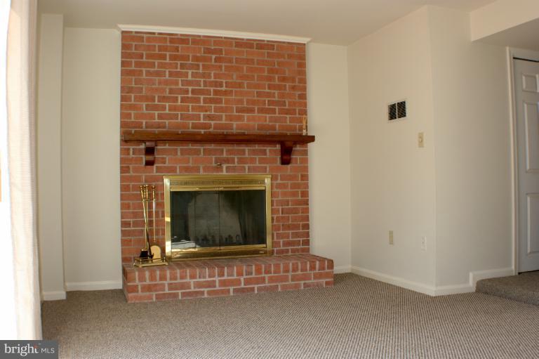 Family Room with Brick Hearth Fireplace