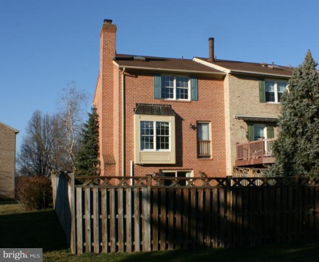 8033 Broken Reed Court Frederick, MD 21701 - Photo 23 of 27 Brick Rear Exterior With Fenced Yard
