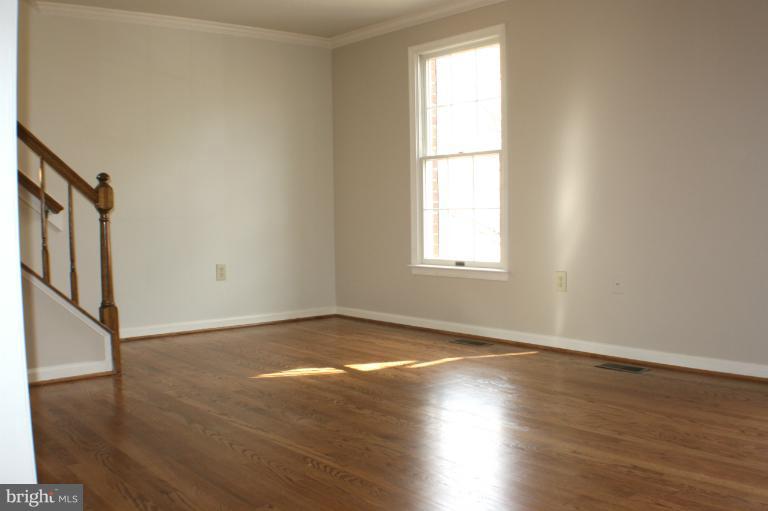8033 Broken Reed Court Frederick, MD 21701 - Photo 9 of 27 Living Room With Gleaming Hardwoods