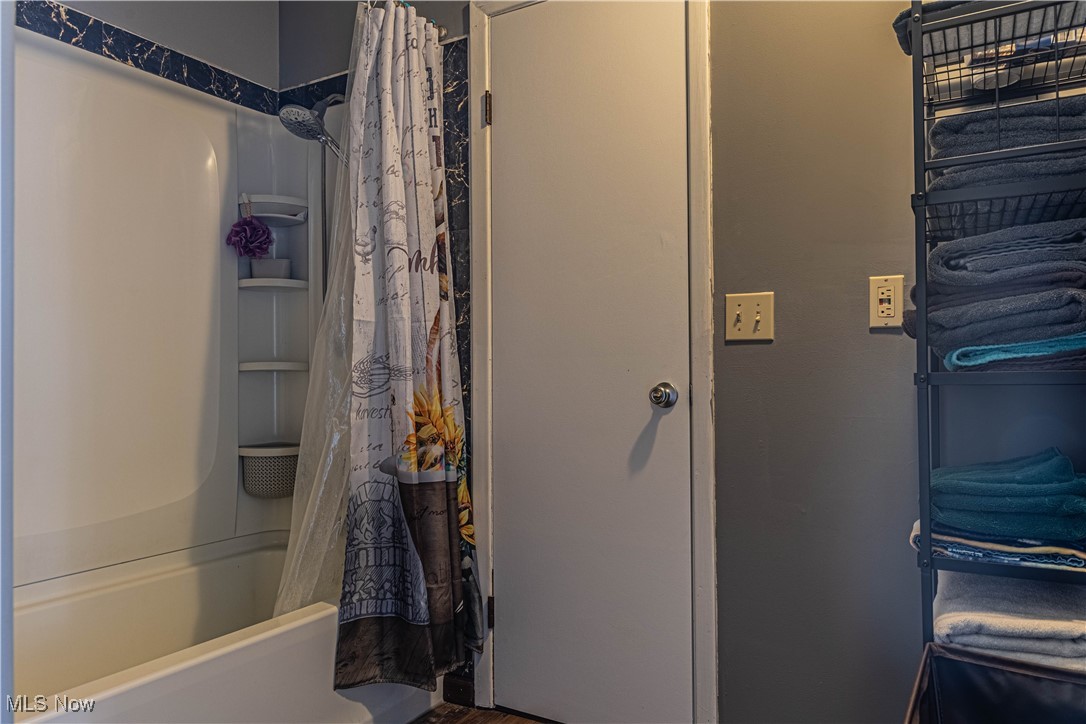 16974 Hawley Road Oberlin, OH 44074 - Photo 27 of 42 Bathroom with shower / bathtub combination with curtain