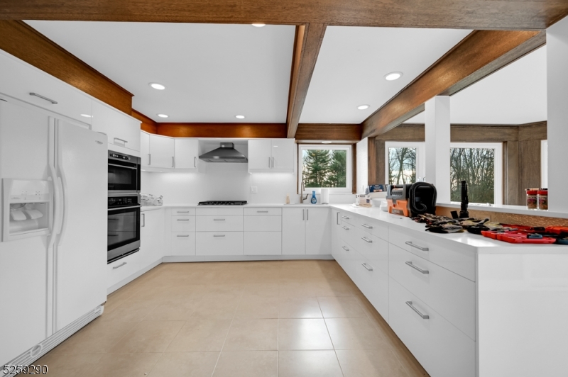 72 Youngs Road Basking Ridge, NJ 07920 - Photo 14 of 31 a large white kitchen with a large window