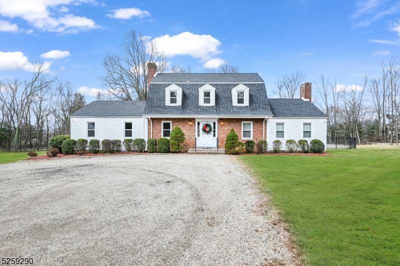 72 Youngs Road Basking Ridge, NJ 07920 - Photo 2 of 31 a front view of a house with a yard and garage